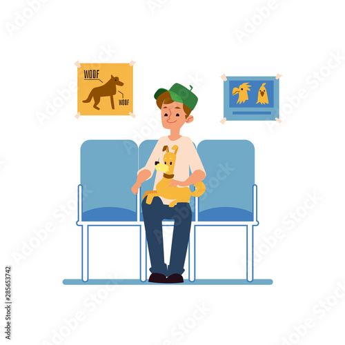 A man with his pet dog is sitting and waiting for a reception at the veterinary clinic.