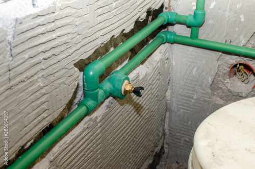 Obraz na plátně New plastic water pipes installed in a chased bathroom wall during renovation wo