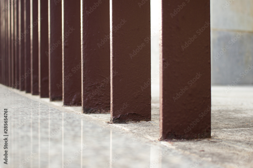 Brown metal fence close-up. City landscape Brown metal fence close-up. City landscape
