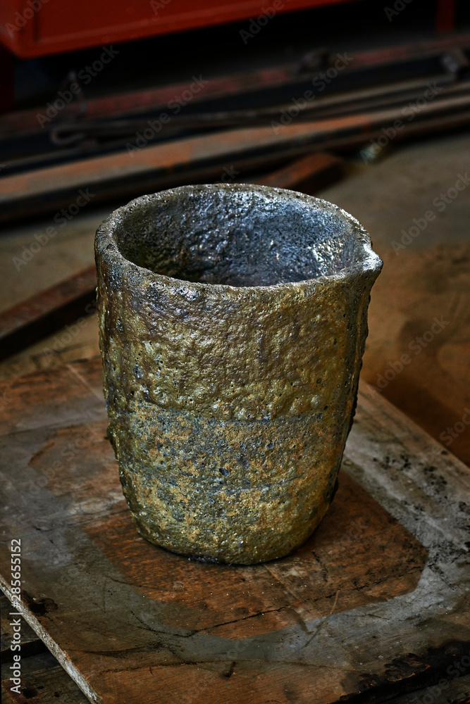 Melting Pot Used To Casting A Bronze Scuplture. Sculpture artist's workshop Melting Pot Used To Casting A Bronze Scuplture. Sculpture artist's workshop