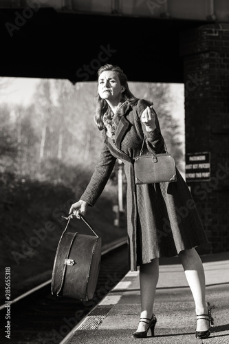 Photos An elegant 40s lady awaits her train at Quorn and Woodhouse with her luggage