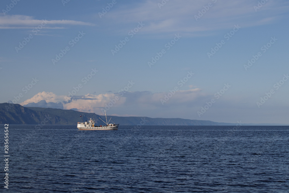 Lake Baikal, Russia. Landscape with a fishing boat.