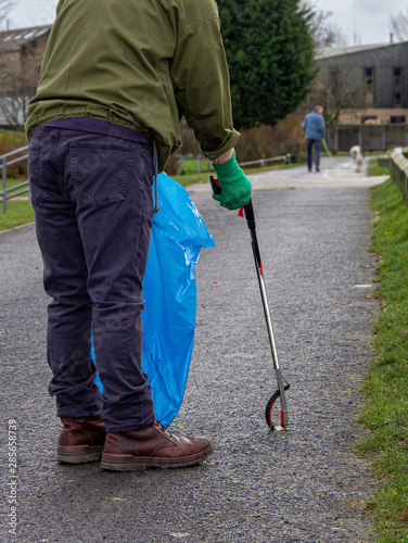 Litterpicking volunteer in park