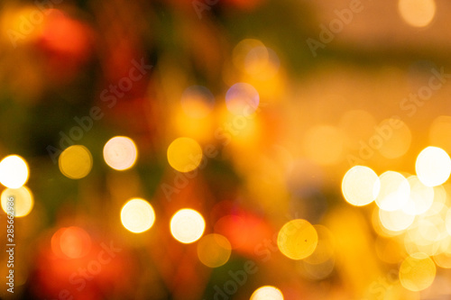 Unfocused Bokeh colorful of Christmas sparkle red and green composition background holiday concept