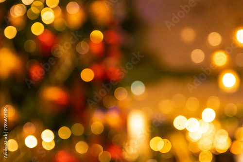 Unfocused Bokeh colorful of Christmas sparkle red and green composition background holiday concept © Rakchanok