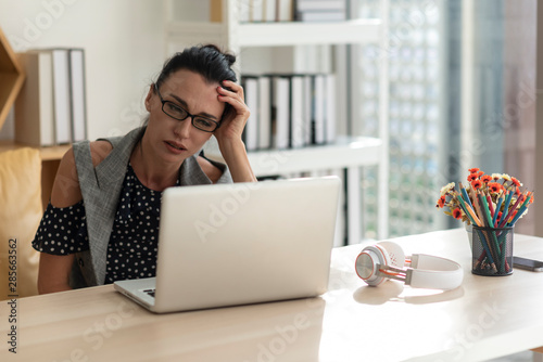 woman working on her laptop at home