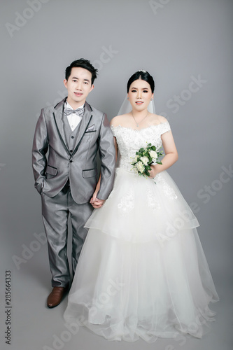 Asian couple taking wedding photography in studio