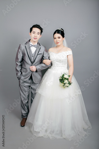 Asian couple taking wedding photography in studio