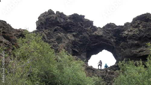 Mývatn, northeast Iceland - July 24 2019: people visit Dimmuborgir, lava fields and volcanic formations. Various volcanic caves and rock formations near Lake Myvatn.