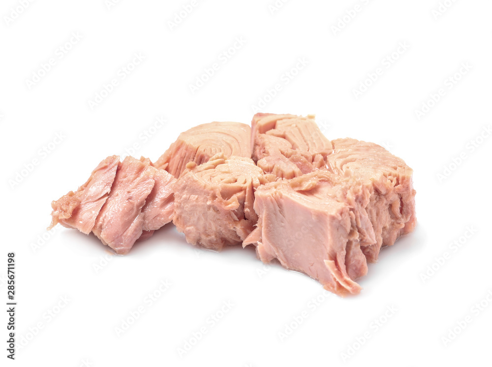 Pieces of canned tuna on white background