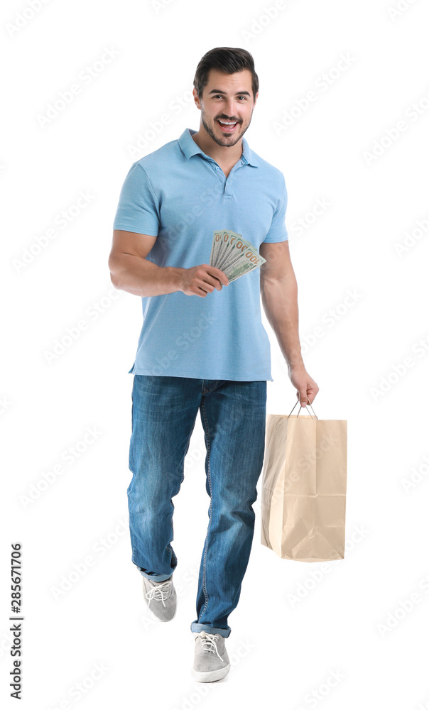 Handsome young man with dollars and shopping bag on white background Handsome young man with dollars and shopping bag on white background