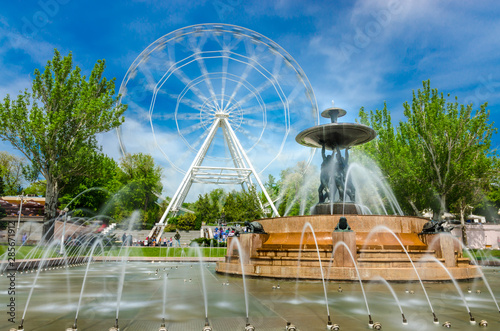 Canvas Print Rostov-na-Donu, Theatre square famous fountain with Atlants and Ferris wheel