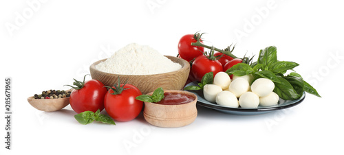 Fresh ingredients for pizza on white background