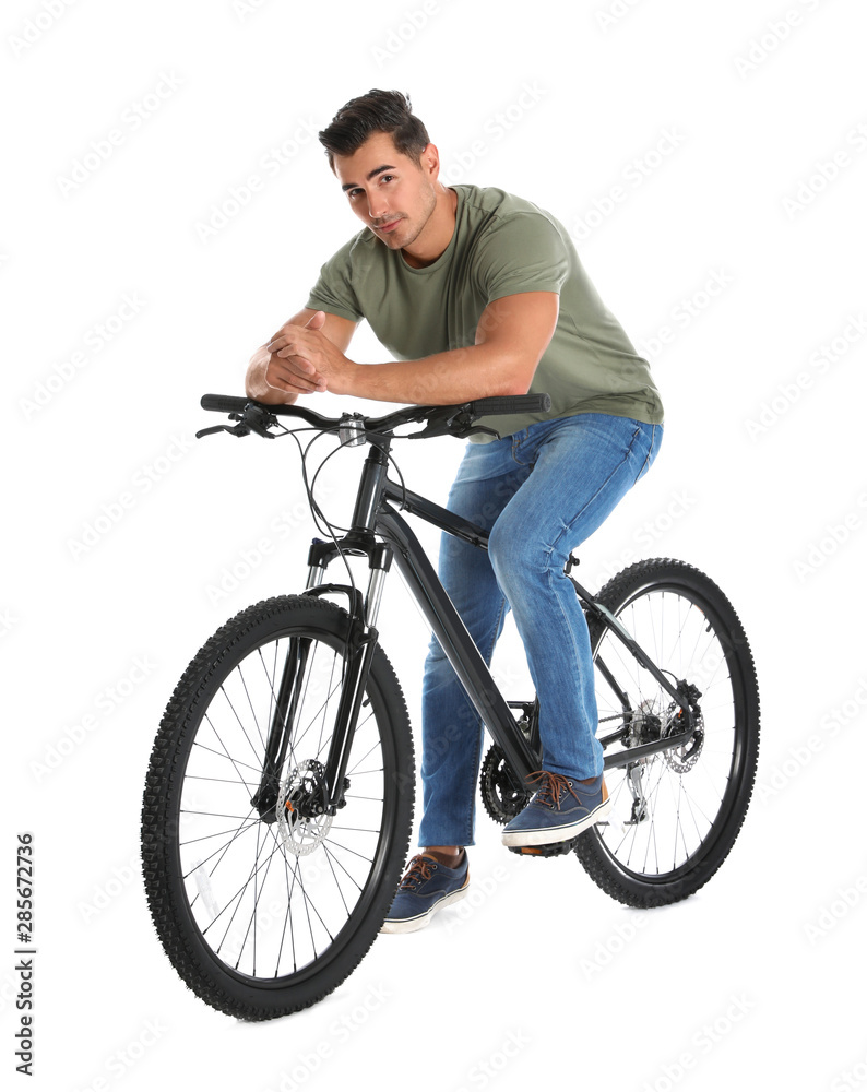Fototapeta premium Handsome young man with modern bicycle on white background