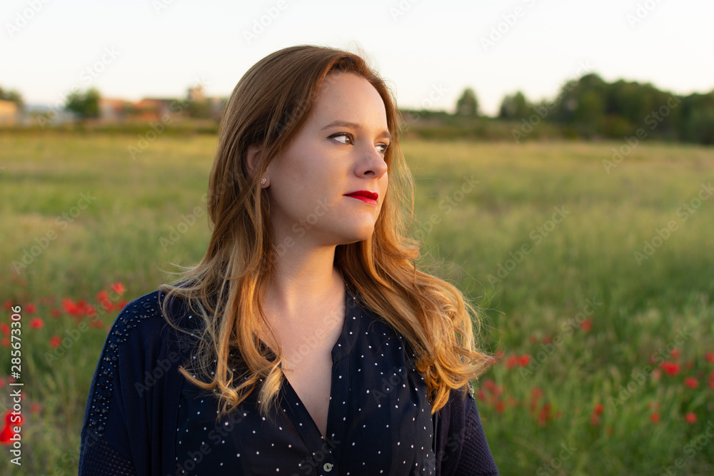 Close up. Portrait of pretty woman looking to the side,