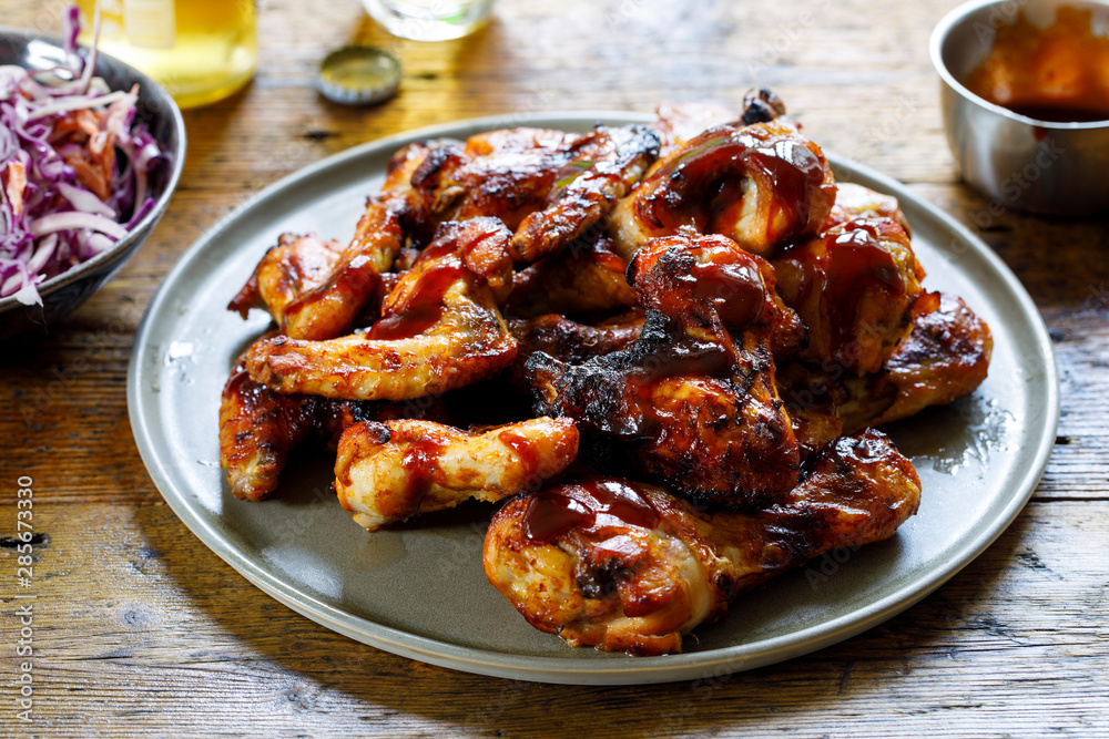 Barbecue chicken wings and drumsticks with sauce