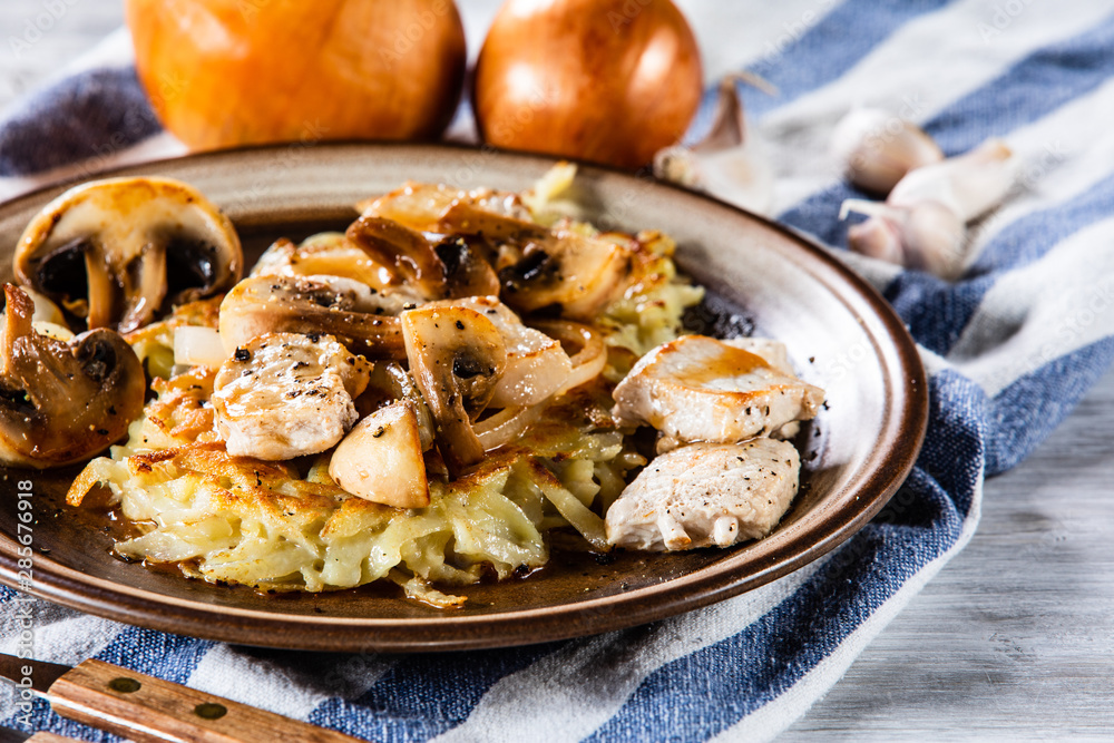 Potato cakes with chopped pork, gravy sauce and champignon Potato cakes with chopped pork, gravy sauce and champignon