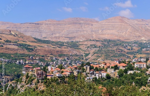 overview of the village of Bcharre, Lebanon, with the mountains in background photo
