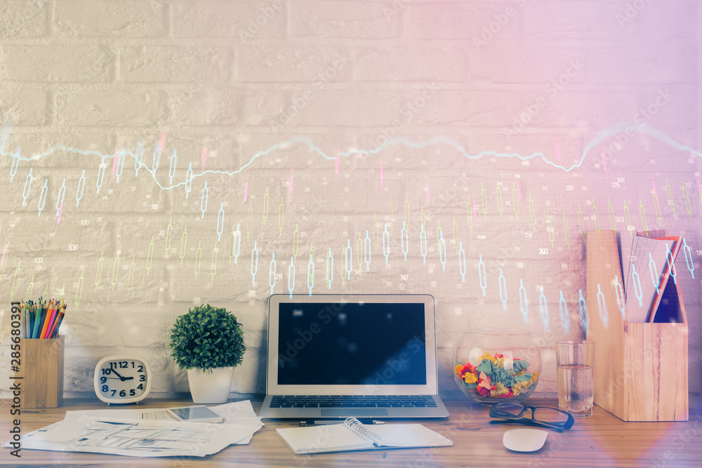 Financial chart drawing and table with computer on background. Multi exposure. Concept of international markets. Financial chart drawing and table with computer on background. Multi exposure. Concept of international markets.