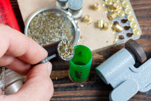 Canvas Print Shotgun shells reloading process with special reload equipment