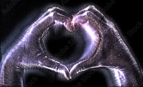 3D-Illustration of a glowing human female hand with a kirlian aura showing different symbols photo