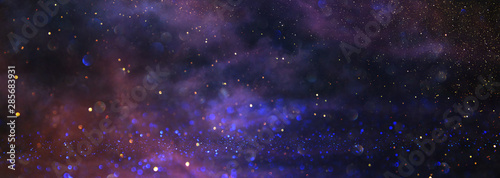 background of abstract glitter lights. blue  purple and black. de focused. banner