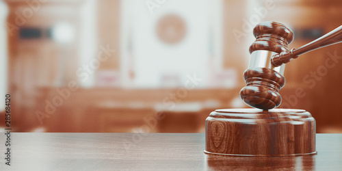 Photo Wooden gavel on table close up. 3d rendering