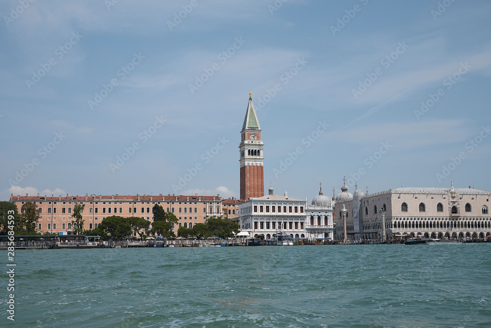Venice, Italy - July 02, 2019 : View of Piazza San Marco and palazzo Ducale from the ferry boat Venice, Italy - July 02, 2019 : View of Piazza San Marco and palazzo Ducale from the ferry boat