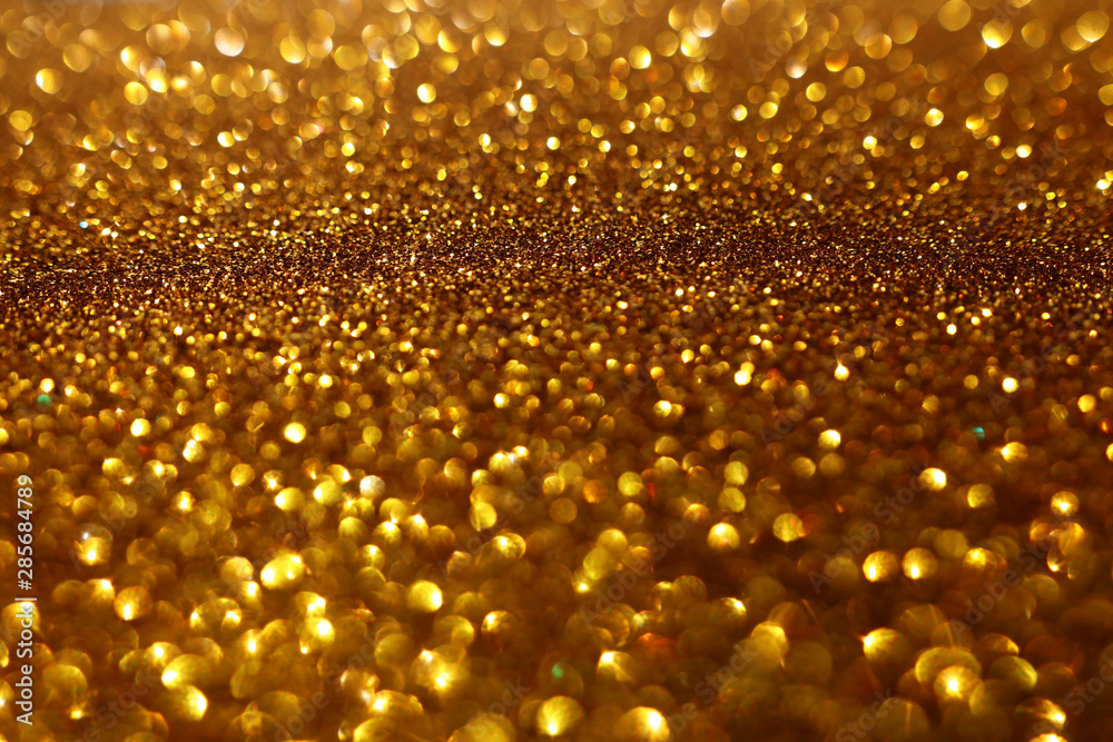 background of abstract glitter lights. gold and black. de-focused background of abstract glitter lights. gold and black. de-focused