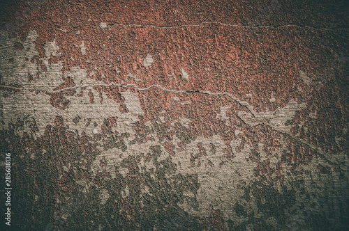 Old brown cracked wall background. Grunge and vingette texture