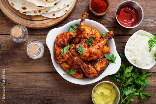 Tandoori chicken with jasmine rice and pita bread, indian cuisine.