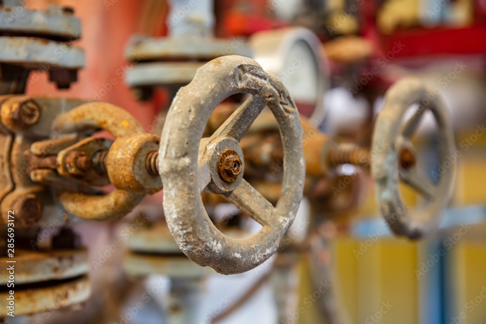 Industrial pipelines and valves close up, blur background Industrial pipelines and valves close up, blur background