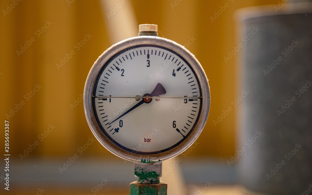 Industrial high pressure gas meters, pipelines and valves on blur background