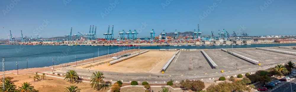 Algeciras, Cadiz, Spain - August 10, 2019: Panoramic view of the sea port of Algeciras, Spain, with the Rock of Gibraltar in the background