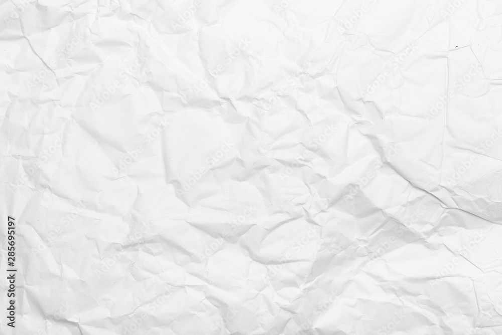 Obraz premium White crumpled paper texture background.