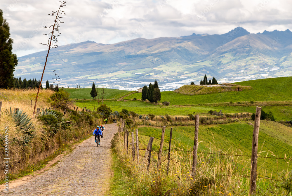 Cayambe volcano and cyclists