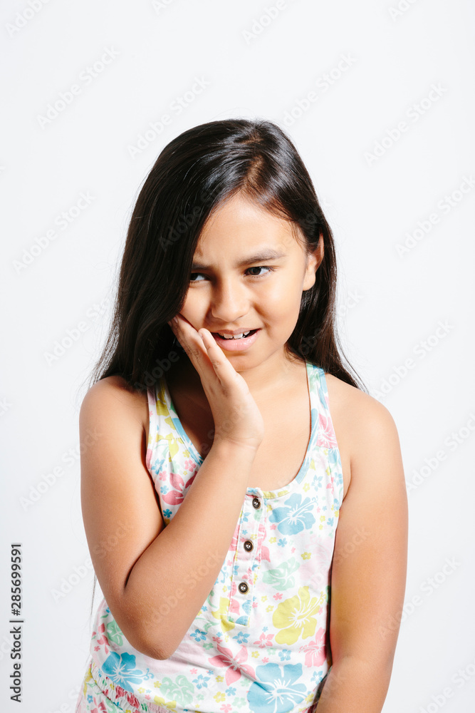 Young girl in pain over white background Young girl in pain over white background