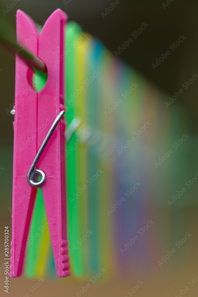 Colored clothespins in blur.