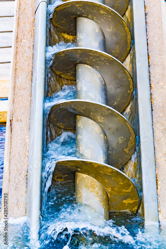 The Archimedes screw, Archimedean screw or screwpump, is a machine historically used for transferring water from a low-lying body of water into irrigation ditches.