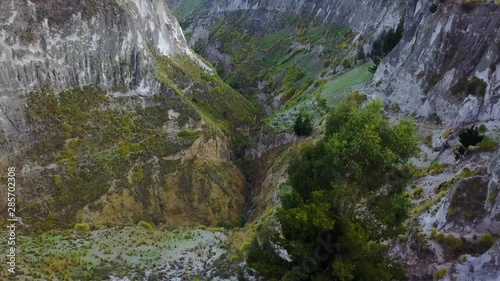 Aerial shot deep canyon near Quilotoa, Ecuador caldera in the Andes Mountains.