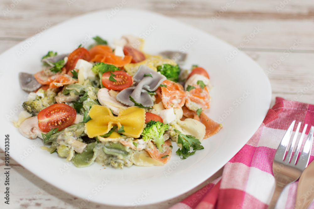 Italian colorful bow tie farfalle pasta with sauce. Italian colorful bow tie farfalle pasta with sauce.