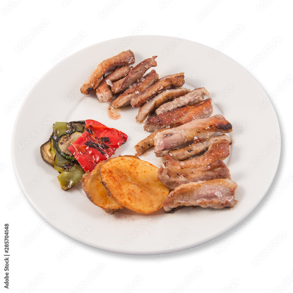Grilled Secreto of Spanish Iberico pork cut with potatoes and grilled vegetables