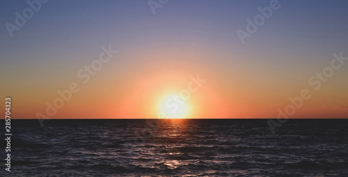 Panorama of beautiful sunset on the ocean.