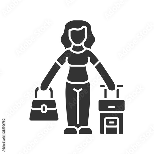 Immigrant woman glyph icon. Traveler, holidaymaker, passenger with handbag and suitcase. Travelling abroad. Immigration, tourism. Silhouette symbol. Negative space. Vector isolated illustration