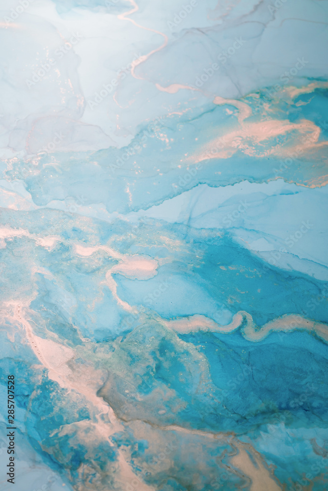 The picture is painted in alcohol ink. Creative abstract artwork made with translucent ink colors. Trendy wallpaper. Abstract painting, can be used as a background for wallpapers, posters, websites.