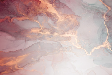 The picture is painted in alcohol ink. Creative abstract artwork made with translucent ink colors. Trendy wallpaper. Abstract painting, can be used as a background for wallpapers, posters, websites.