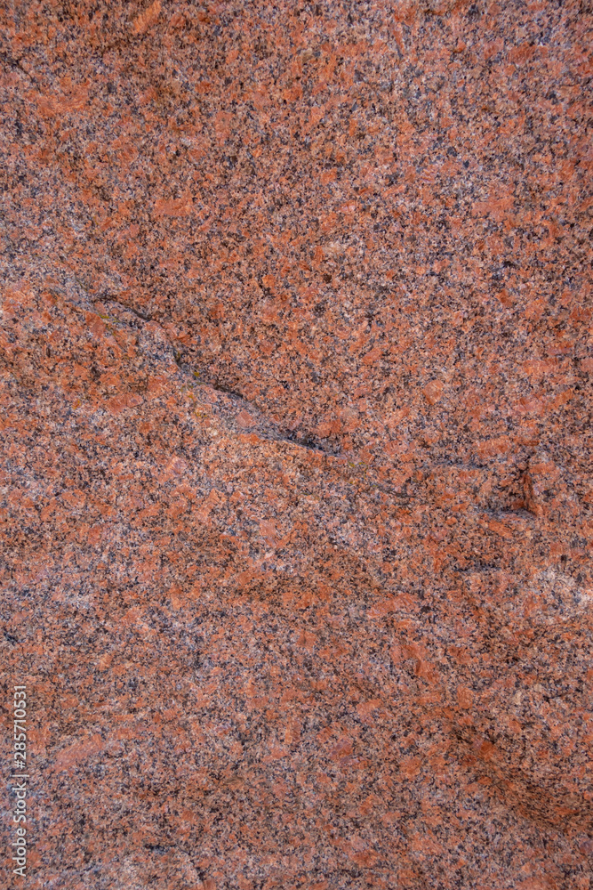 The structure of red and black granite. The texture of natural stone. Creative vintage background. The structure of red and black granite. The texture of natural stone. Creative vintage background.