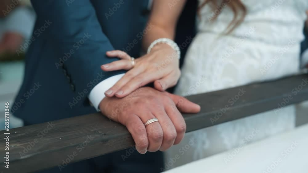 Close up hand of bride strokes hand of groom, slow motion, wedding day Close up hand of bride strokes hand of groom, slow motion, wedding day
