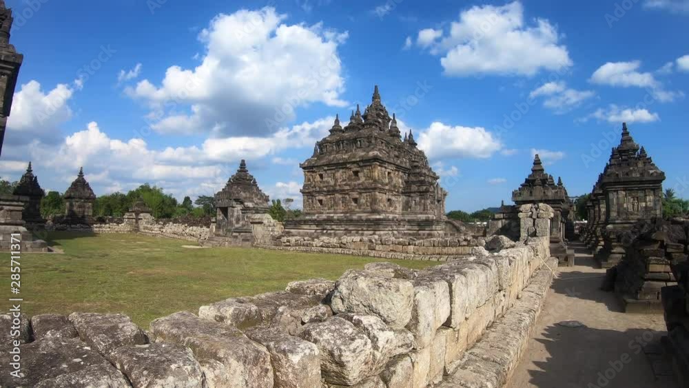 Tourist backpacker use camera to take the picture the Plaosan temple in Java island,Indonesia Tourist backpacker use camera to take the picture the Plaosan temple in Java island,Indonesia