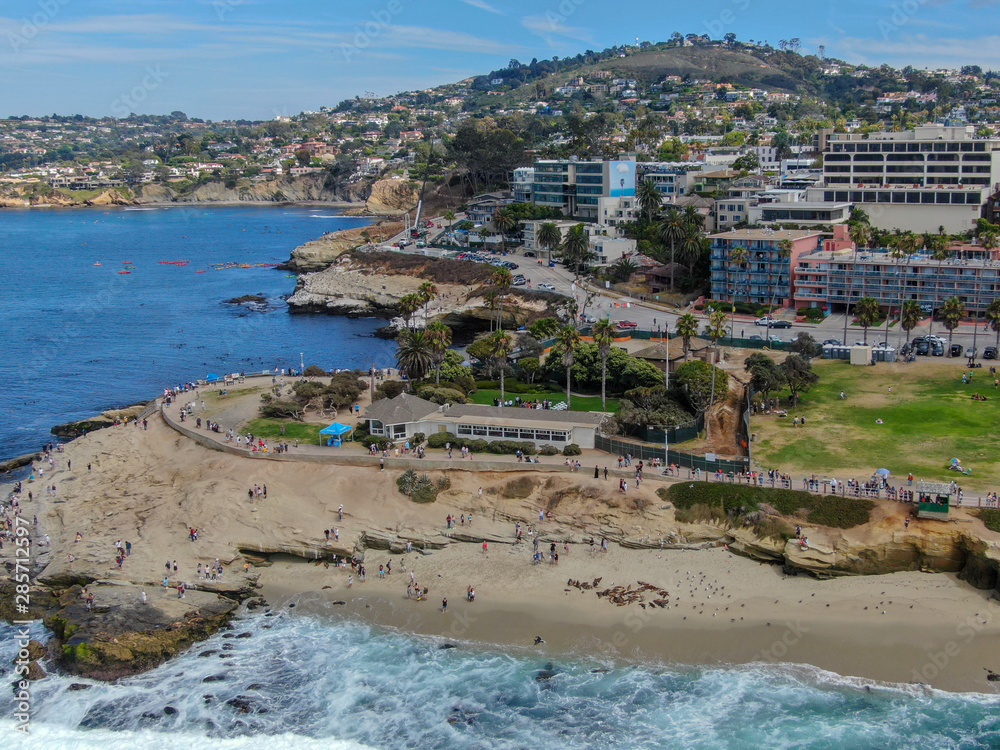 Aerial view of La Jolla Cove, small picturesque cove and beach surrounded by cliffs, San Diego, California. Protected marine reserve, popular with snorkelers and swimmers. Travel destination.